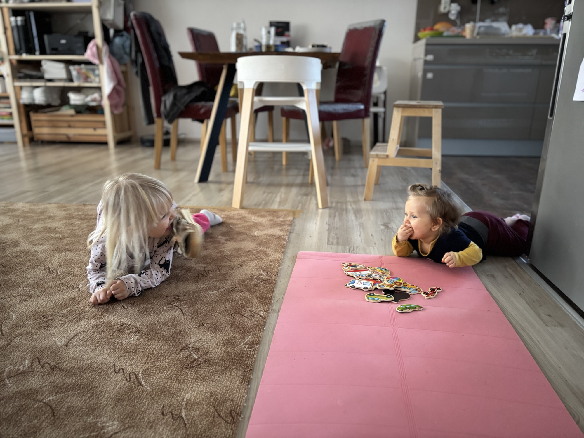 Two kids playing on the floor, intentional parenting by design